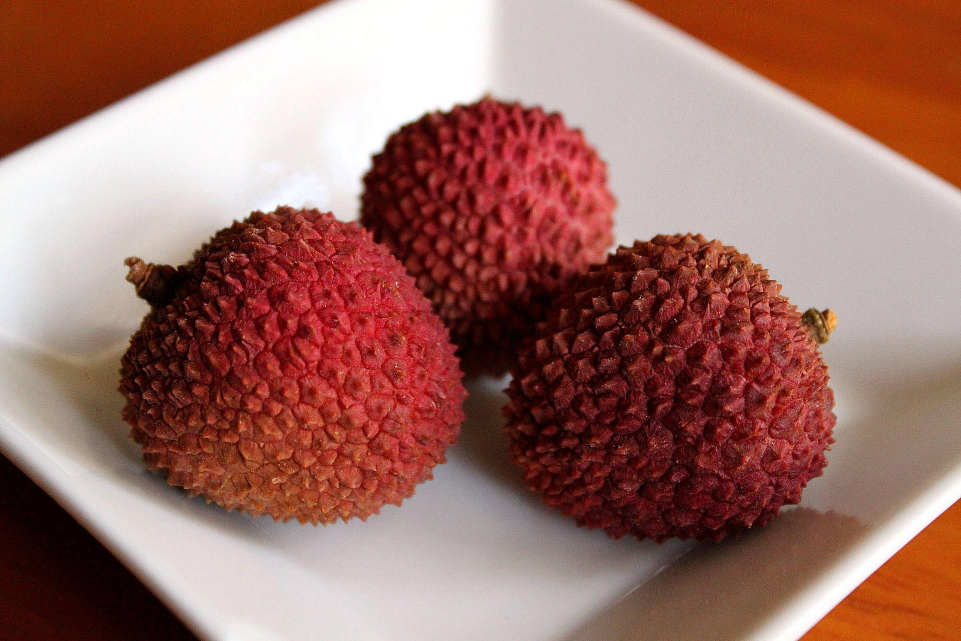 Three Litchis On Plate