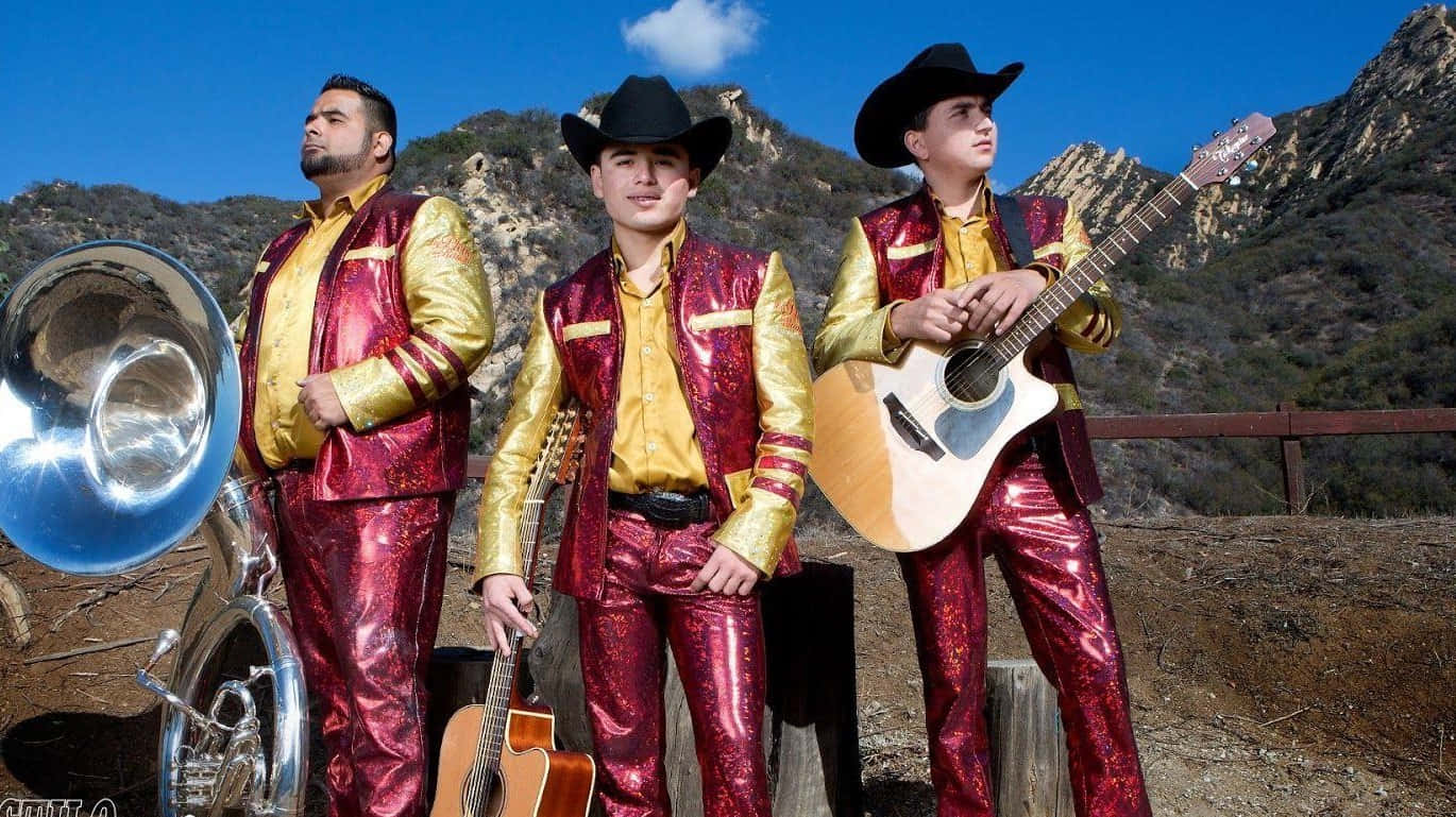 Three Men In Mexican Outfits Standing Next To A Guitar Background