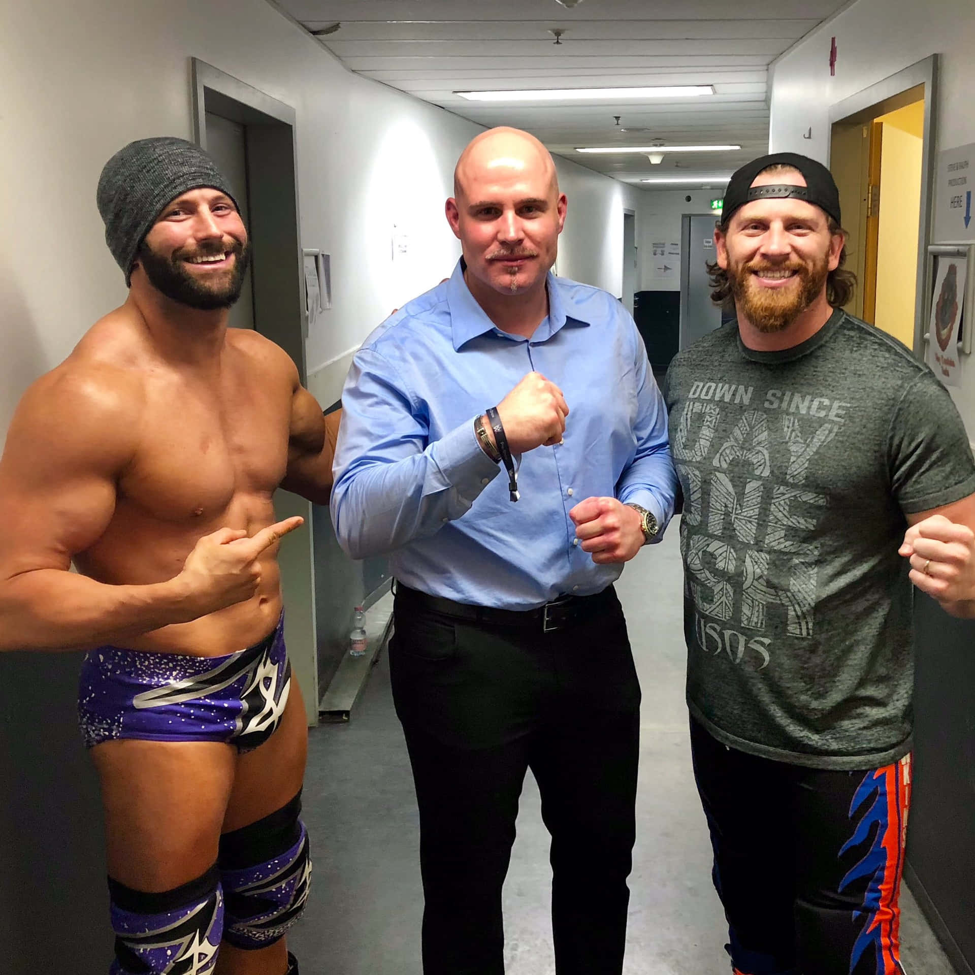 Three Men Posing Backstage