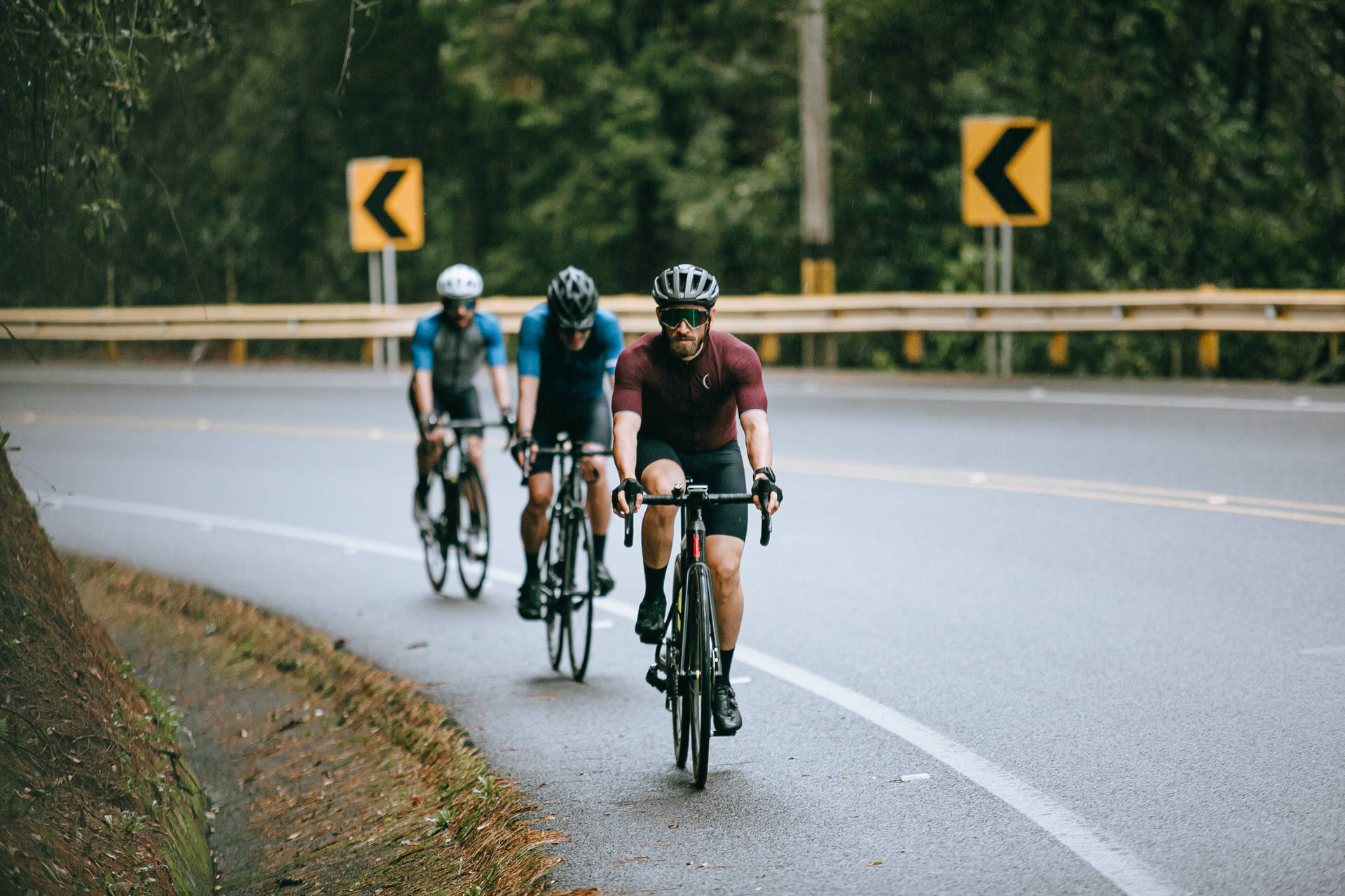 Three Men Winding Road Cycling
