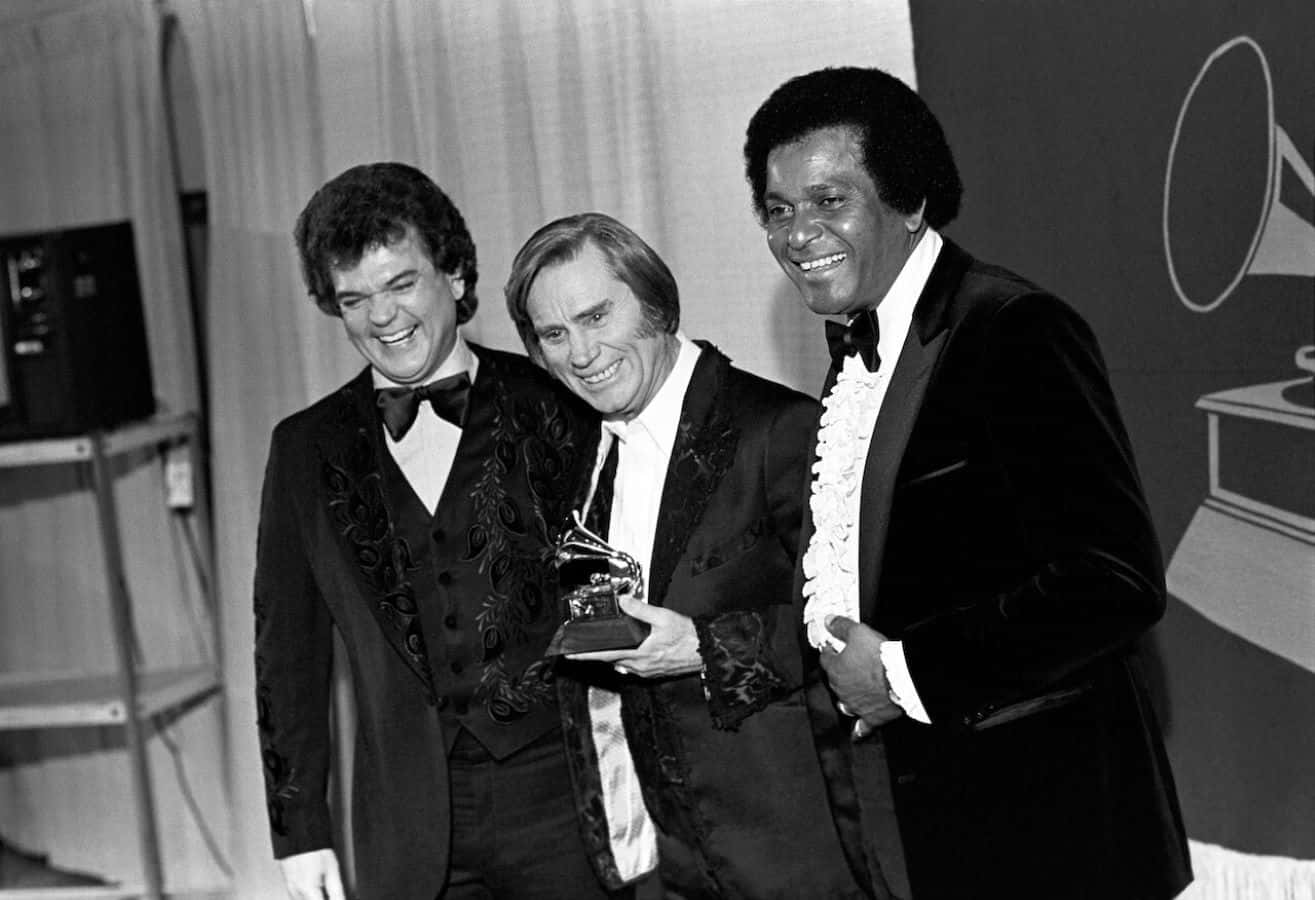 Three Musicians Celebratingat Awards Ceremony Background