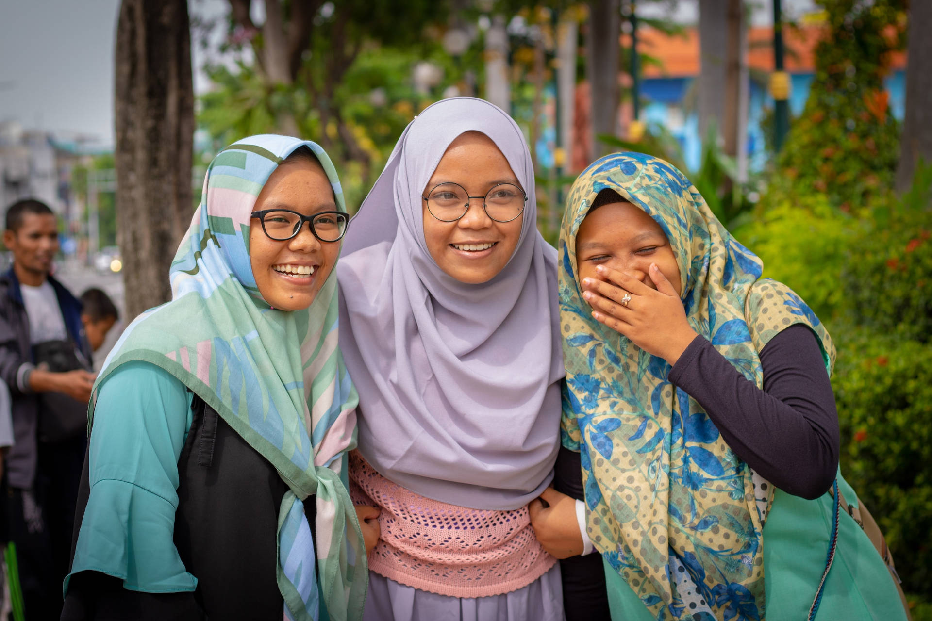 Three Muslim Teenagers Laughing Background