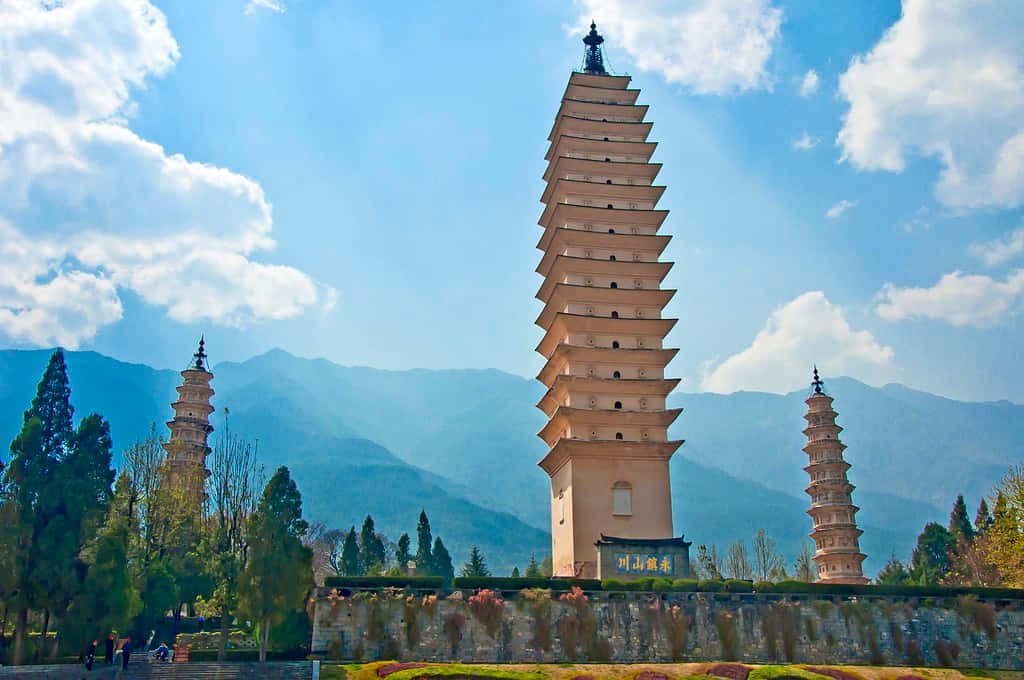 Three Pagodas Under Bluish Sky Background