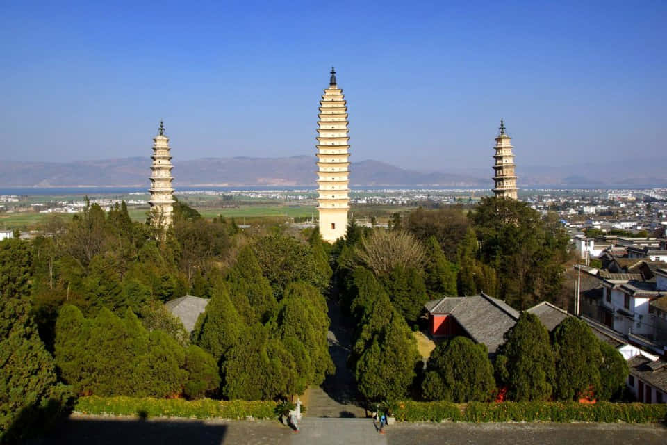 Three Pagodas With Green Trees
