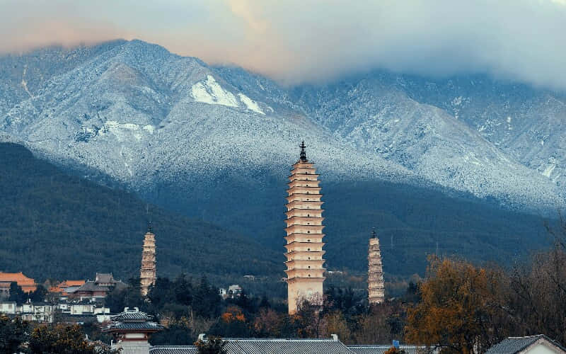 Three Pagodas With Mountain View Background
