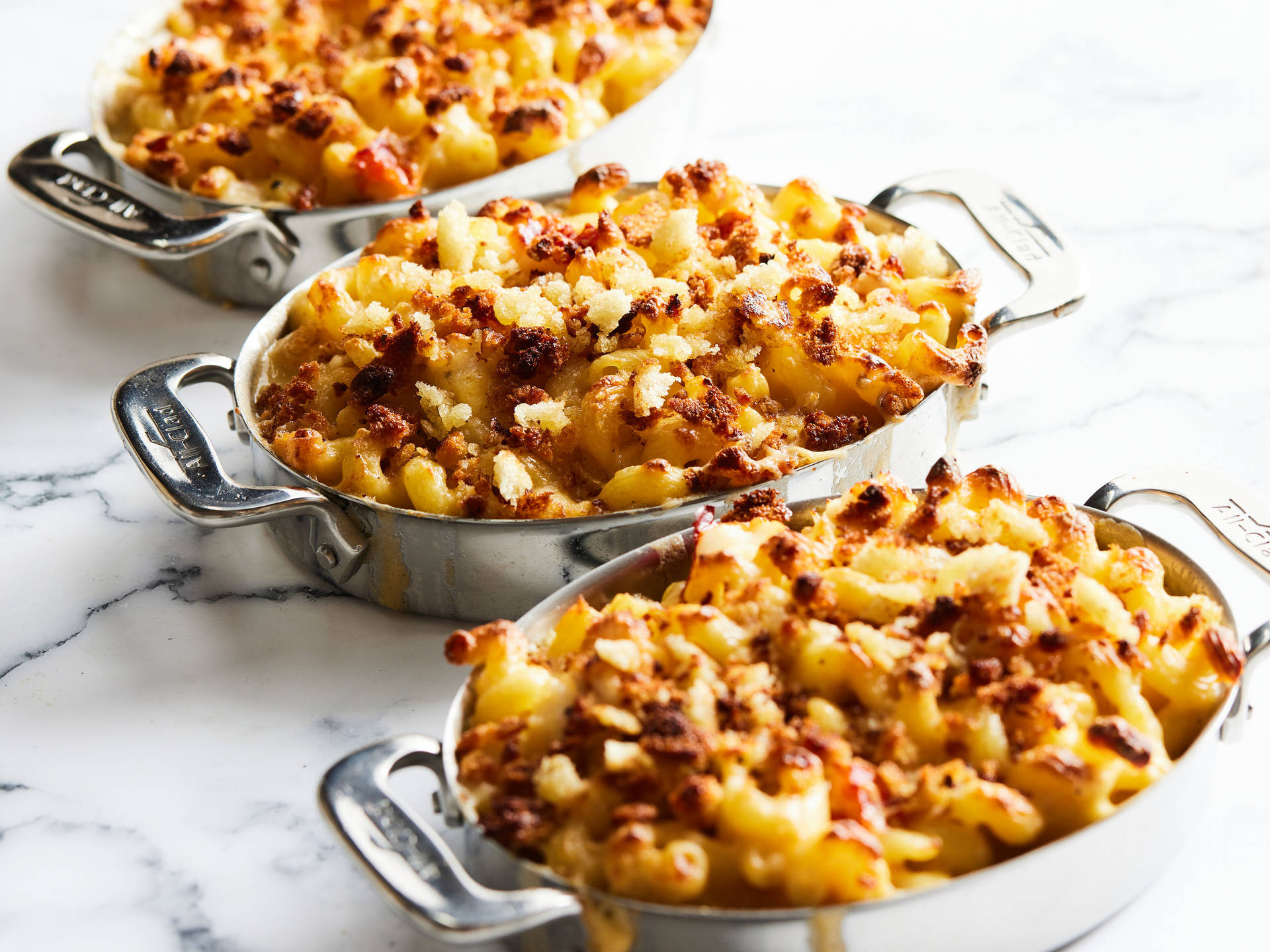 Three Pans Of Baked Mac And Cheese