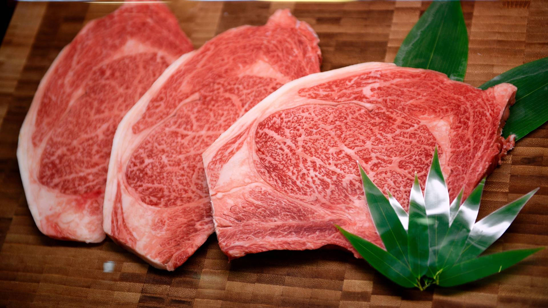 Three Pieces Of Kobe Beef Background