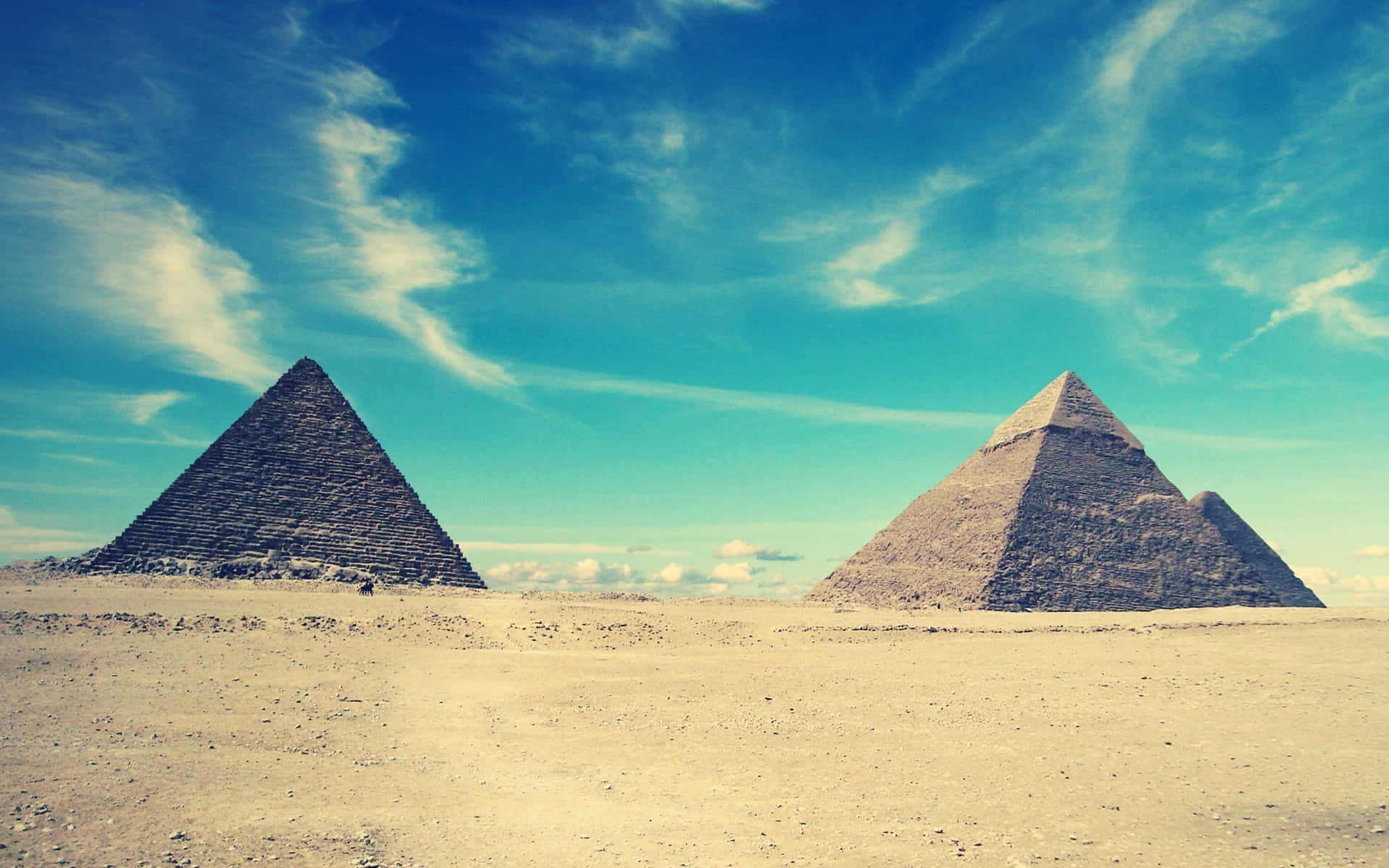 Three Pyramids In The Desert Background