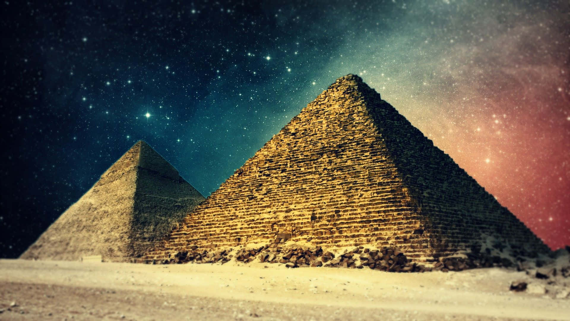 Three Pyramids In The Desert With Stars In The Sky Background