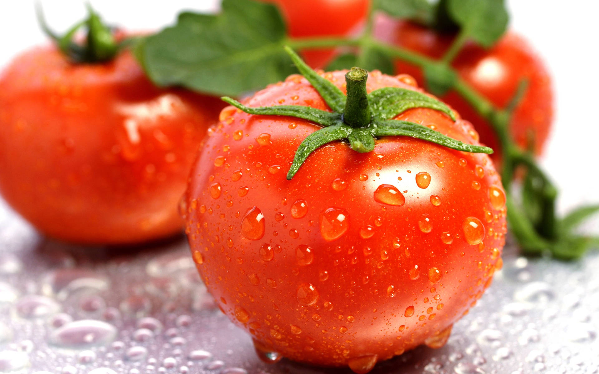 Three Red Ripe Tomato Fruits Background