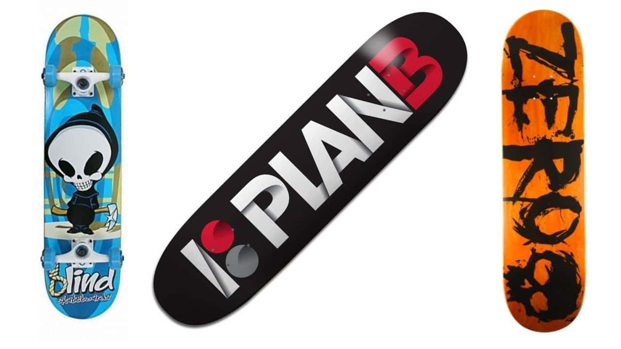 Three Skateboards With Different Designs On Them Background