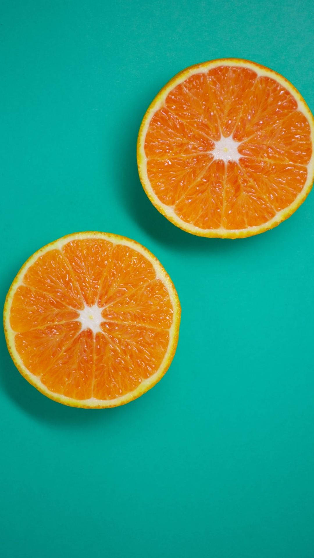 Three Sliced Orange Fruits Background