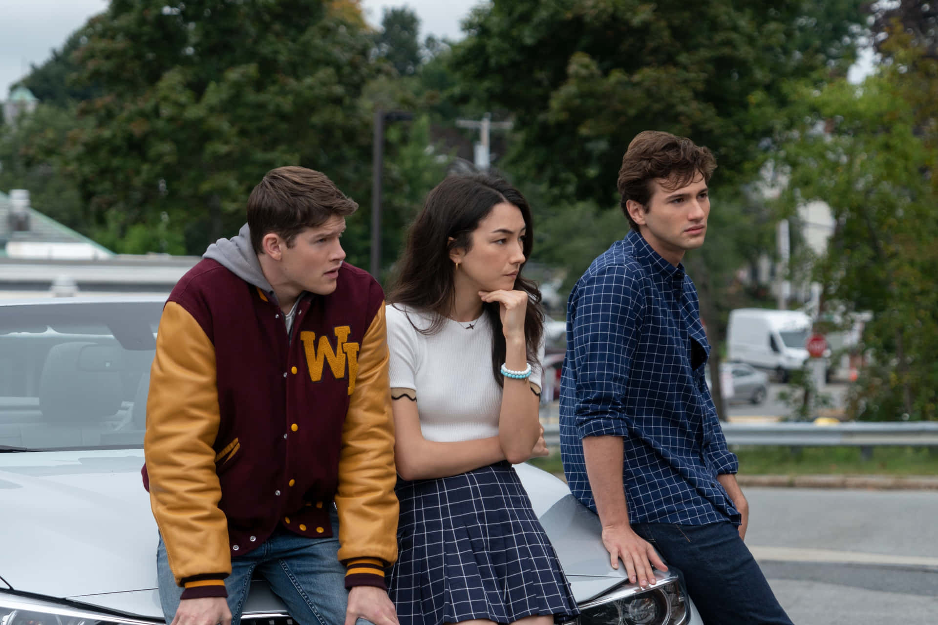 Three Teenagers Leaningon Car Background