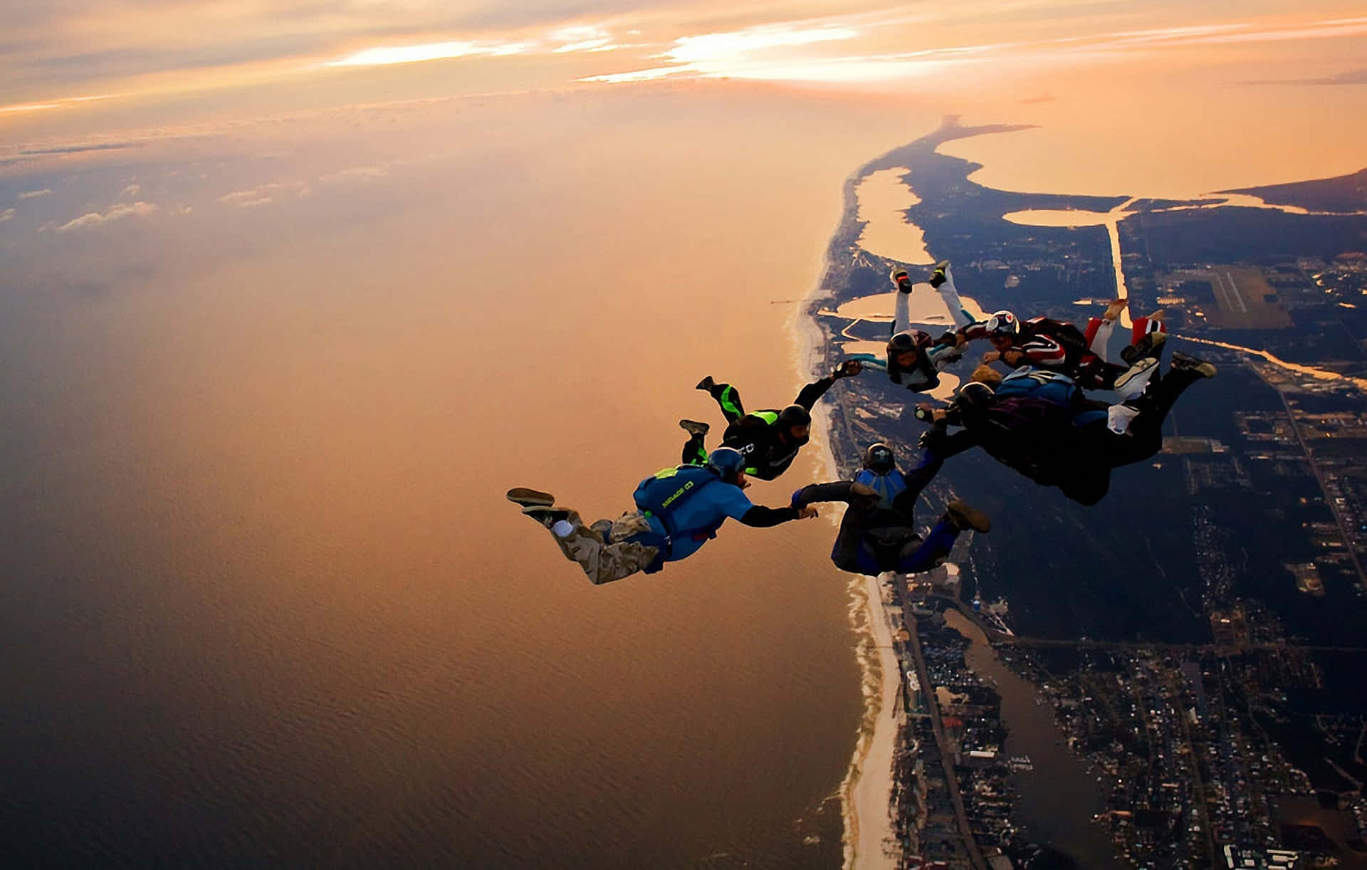 Thrilling Adventure In The Sky - Skydiving Formation Background