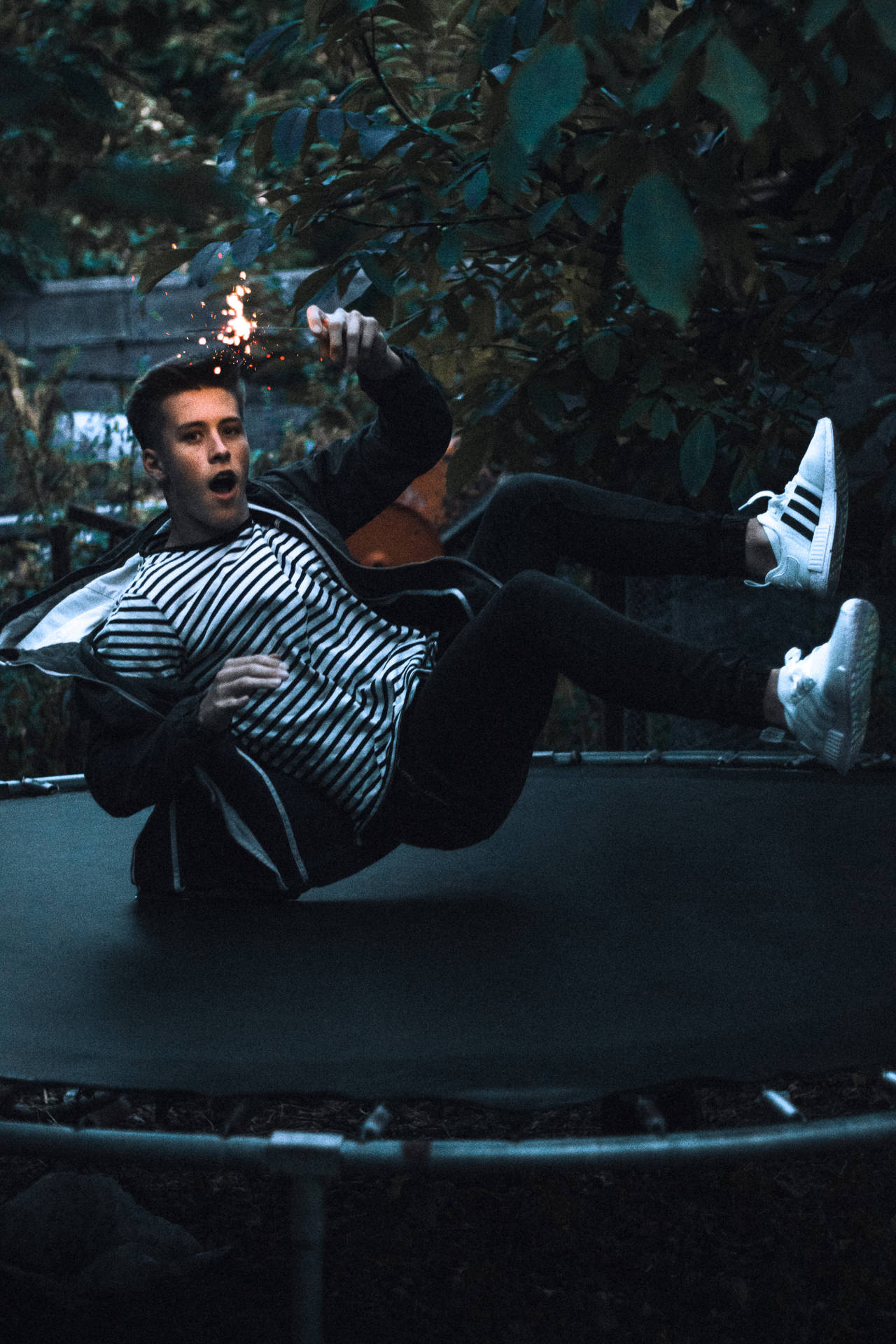 Thrilling High Jump On A Trampoline Background