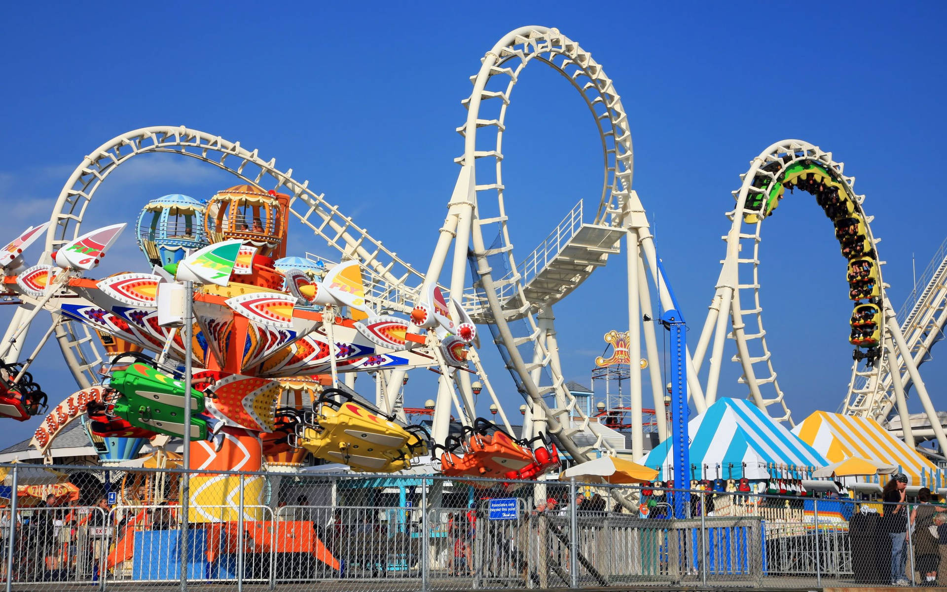Thrilling High-speed Roller Coaster Background