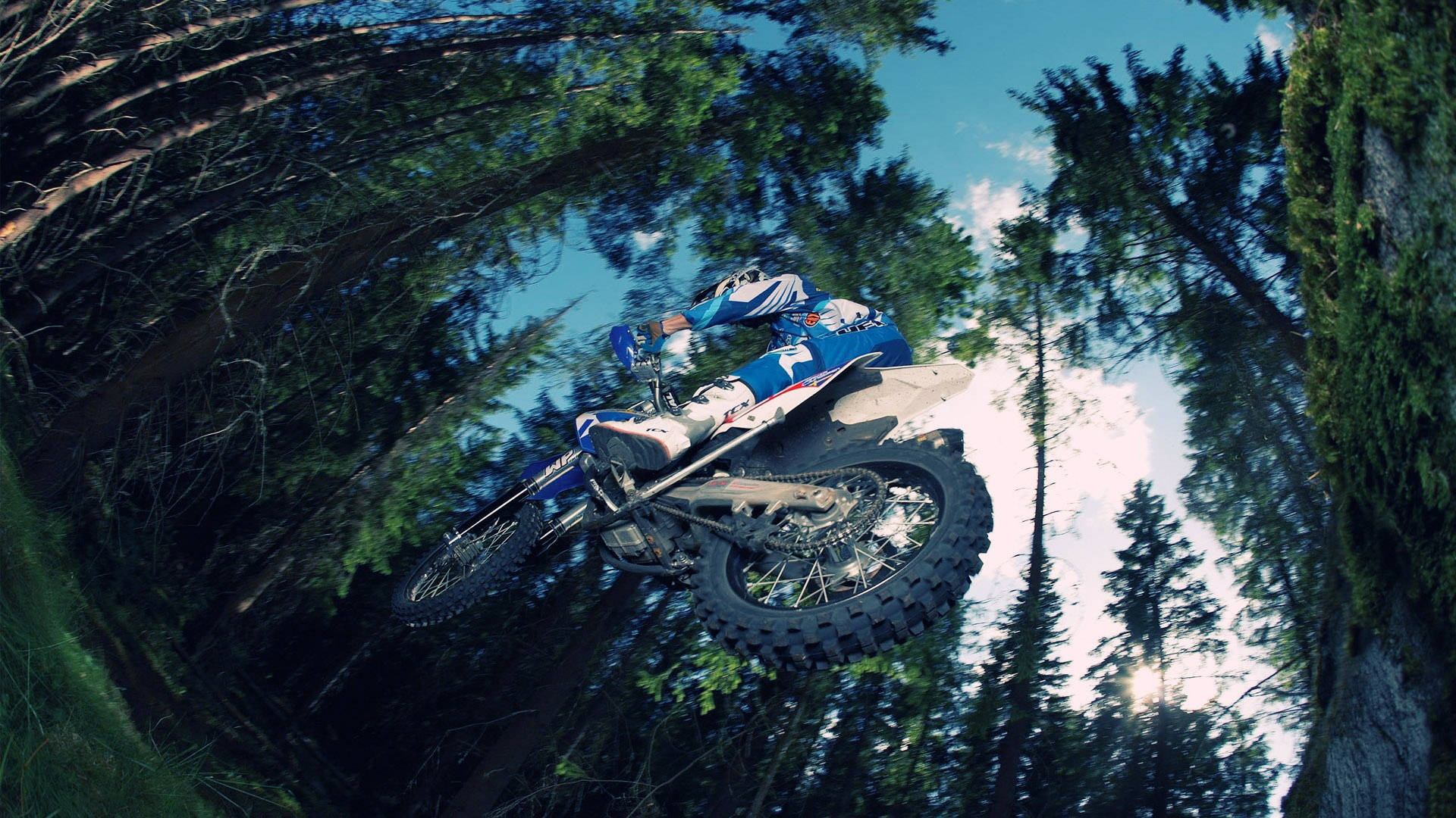 Thrilling Low Angle Shot Of A High-speed Dirt Bike Background