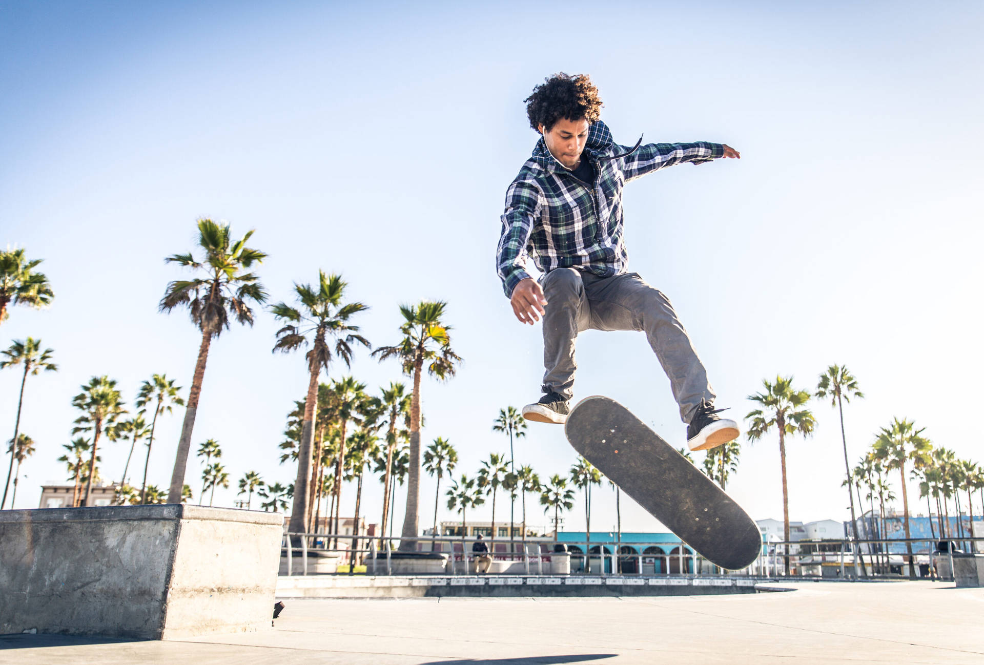 Thrilling Mid-air Capture Of A Skateboarder Executing A Nollie Fs Pop Shove-it Trick.