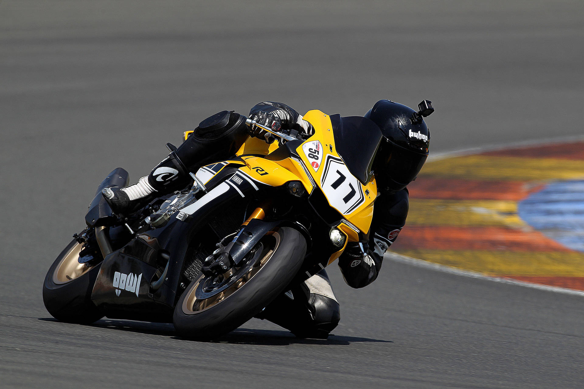 Thrilling Momentum In Motorcycle Racing Background