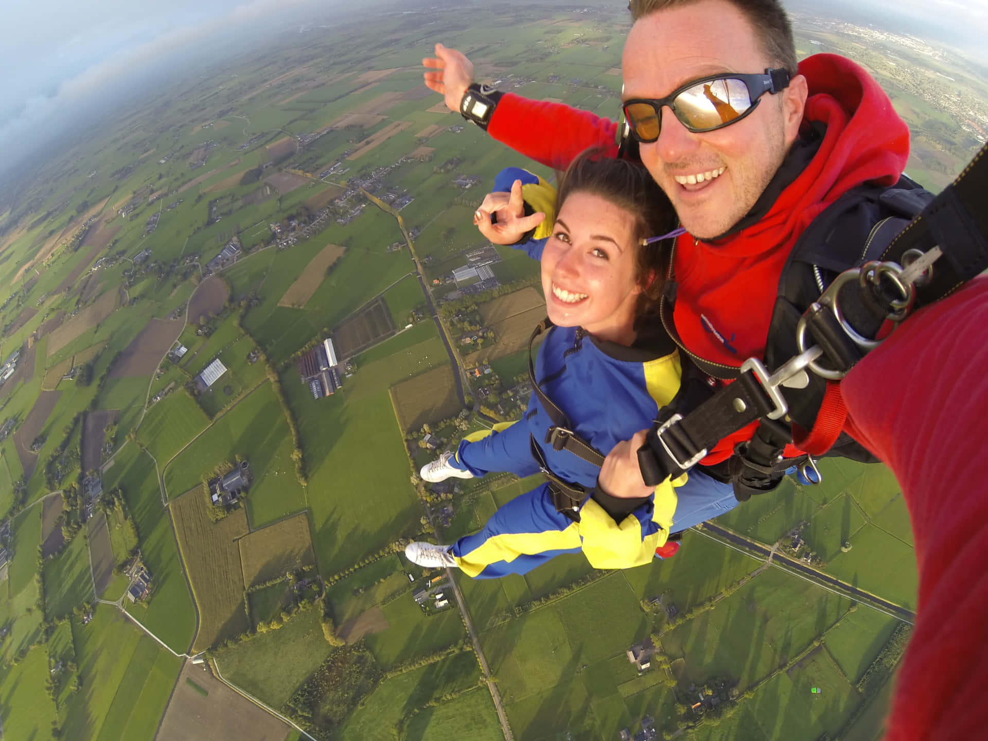 Thrilling Skydiving Selfie Over Lithuania Background