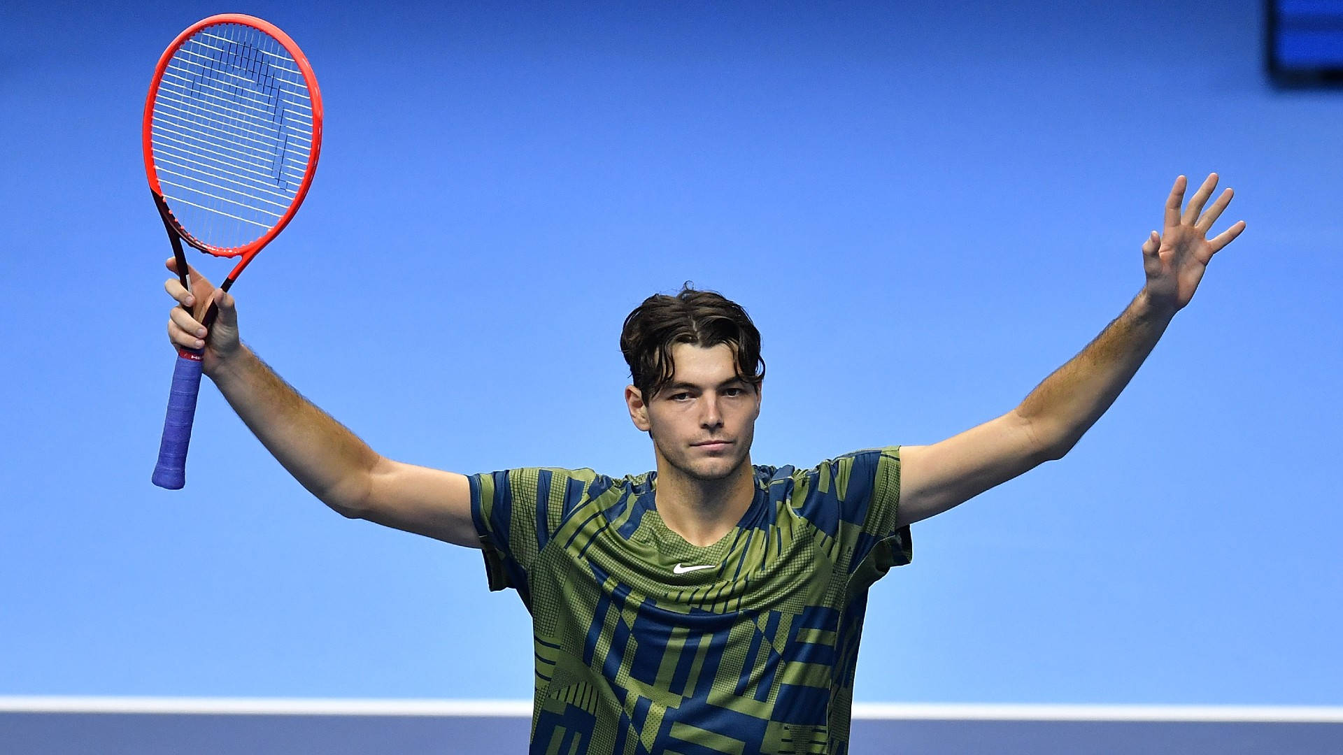 Thrilling Victory - Taylor Fritz Celebrating Success Background