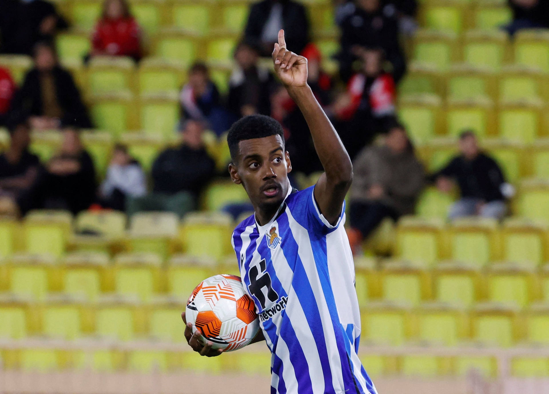 Thriving Footballer Alexander Isak Celebrating Success Background