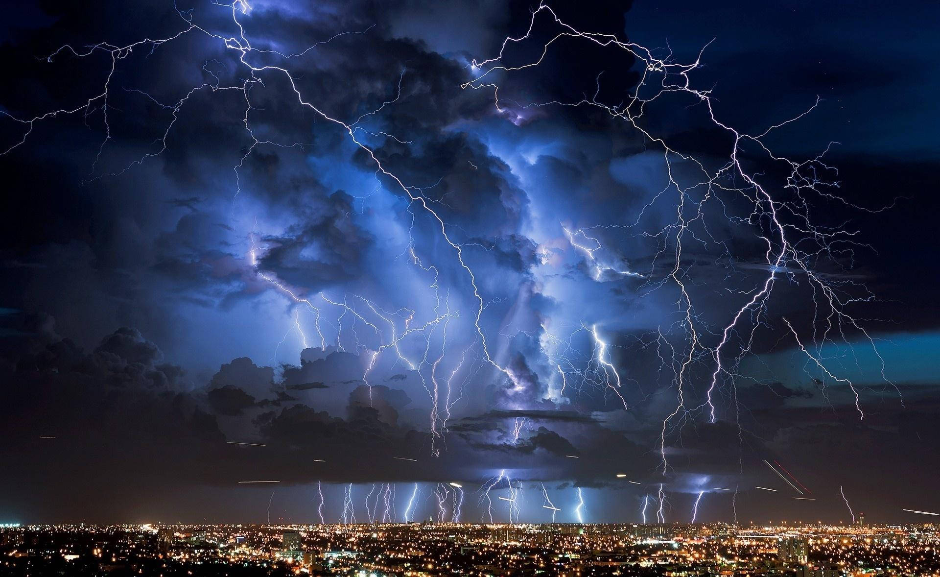 Thunderstorm Over Bright City Background