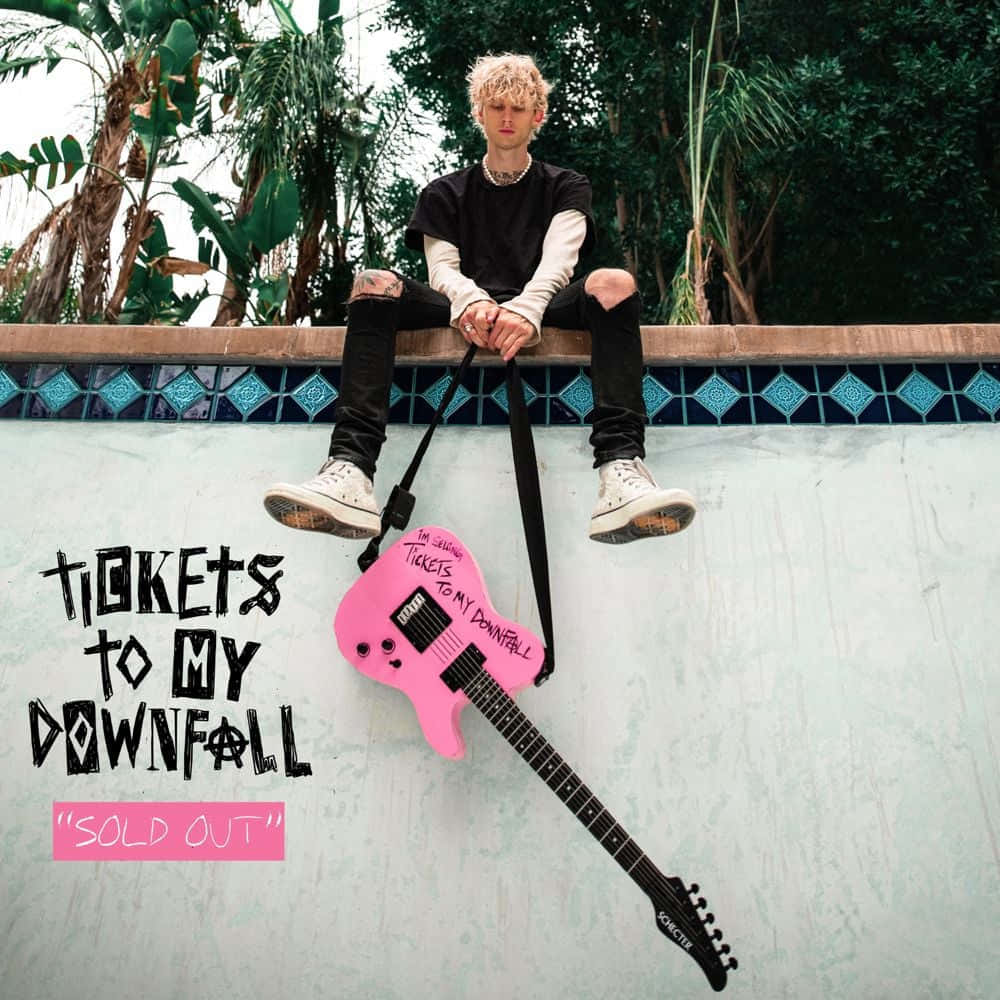 Tickets To My Downfall Machine Gun Kelly Sitting On Wall Background