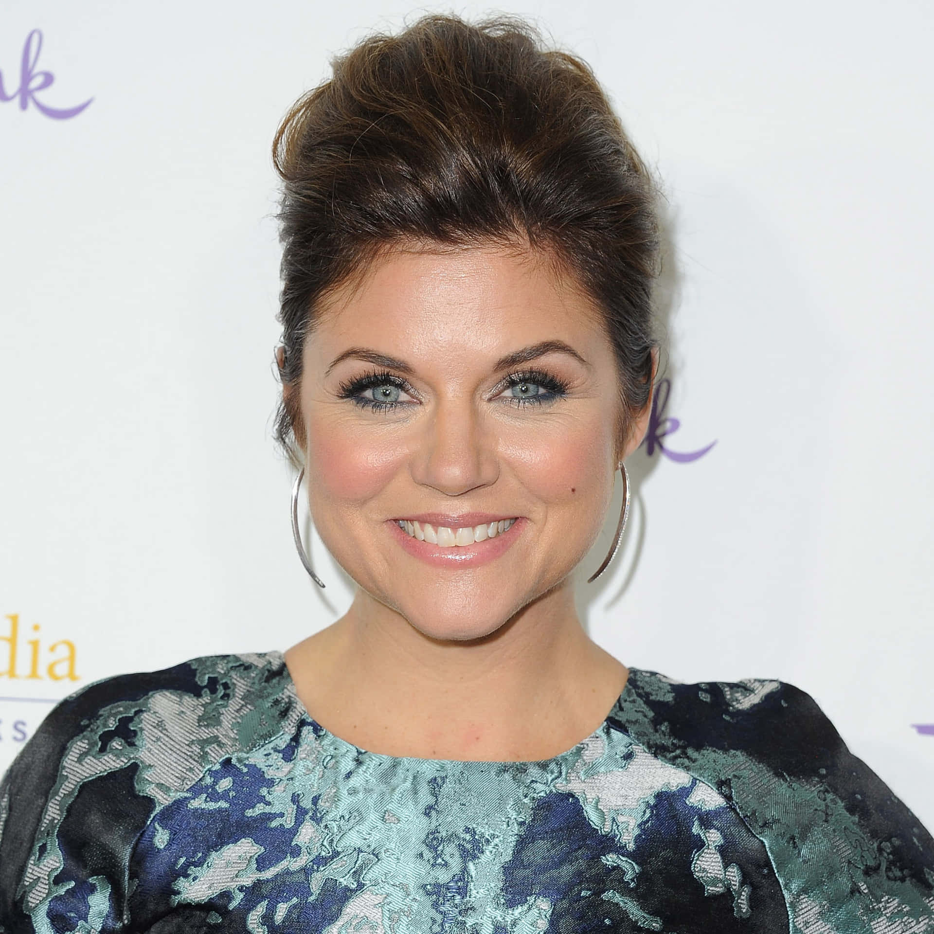 Tiffani Thiessen Smiling Radiantly In A Casual Outfit