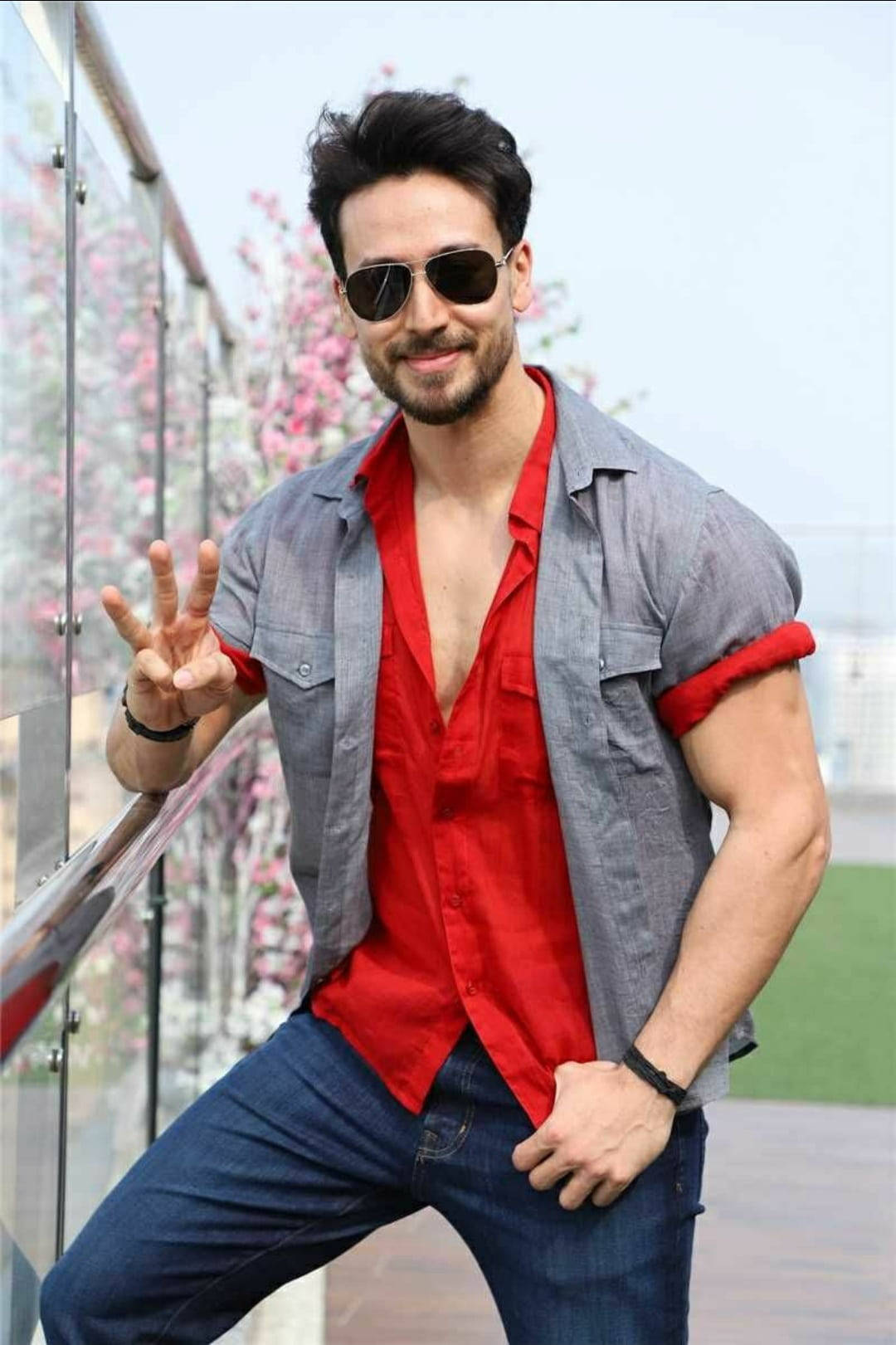 Tiger Shroff Body With Red And Gray Outfit Background