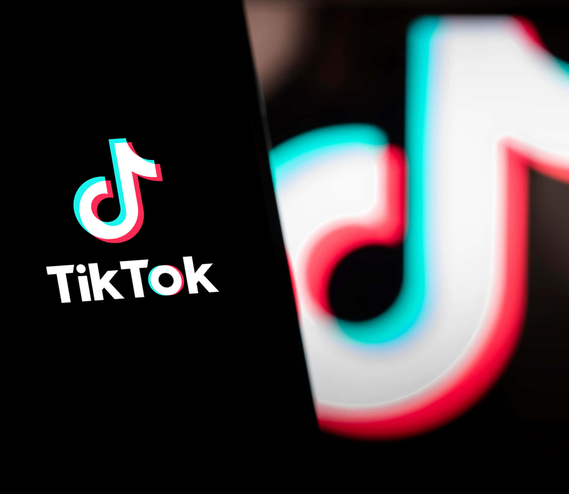 Tiktok Logo With A Black Background Background