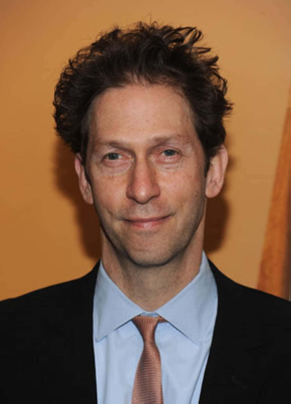 Tim Blake Nelson Posing For A Photoshoot Background