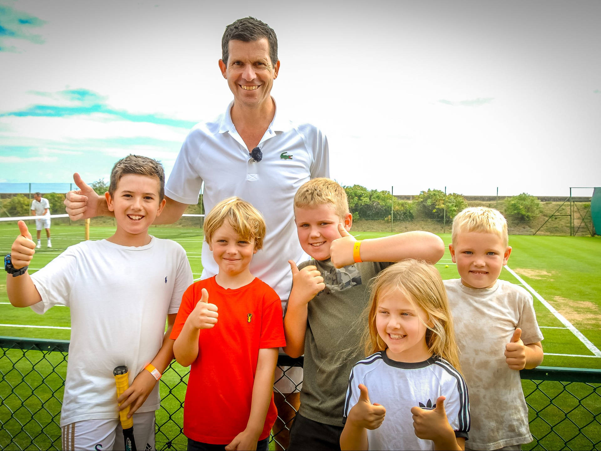 Tim Henman Posing With Kids Background