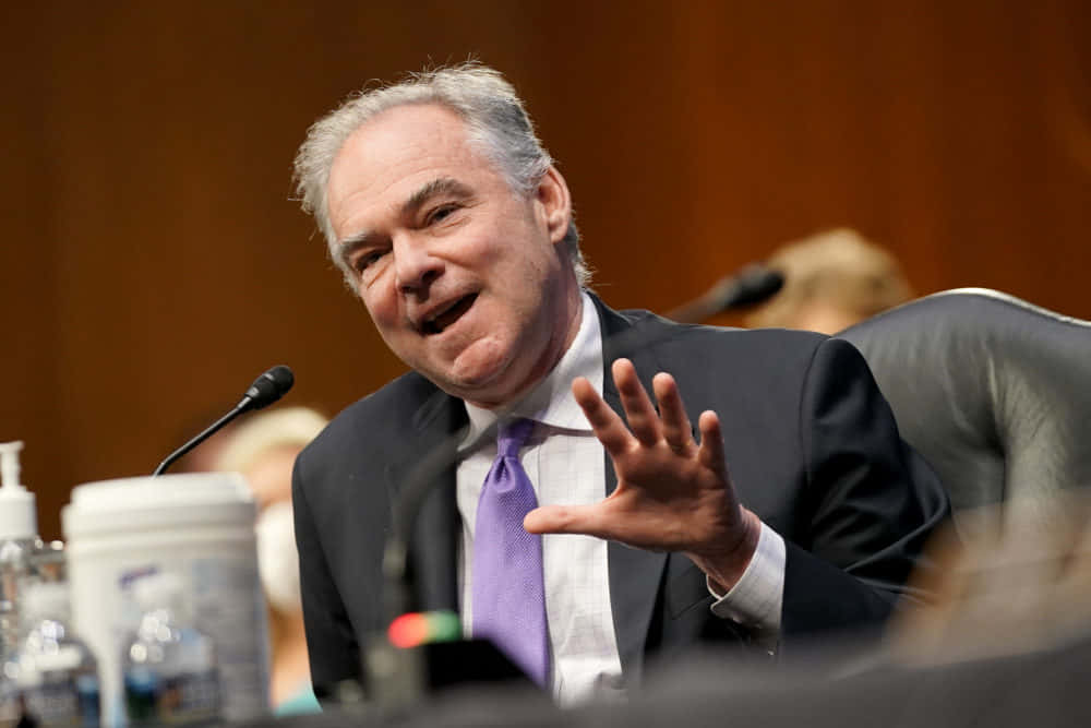 Tim Kaine Passionately Speaking Into Microphone Background