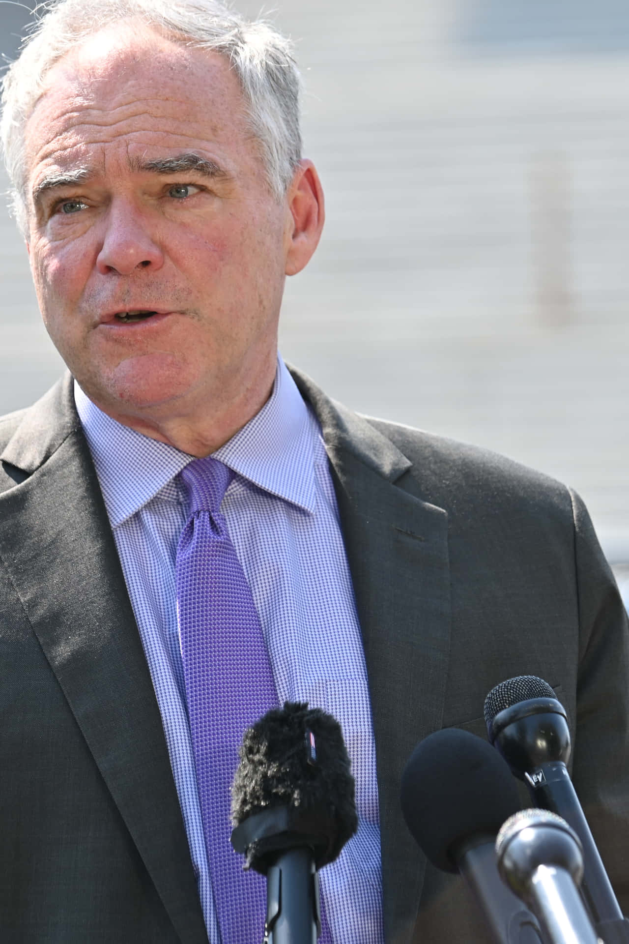 Tim Kaine With Purple Tie Background