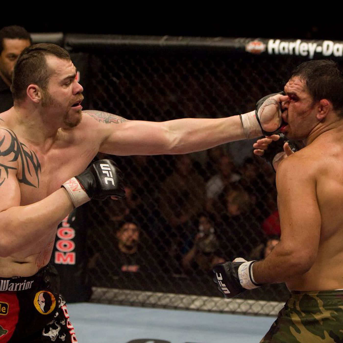 Tim Sylvia Vs Frank Mir In A Ufc Match Background
