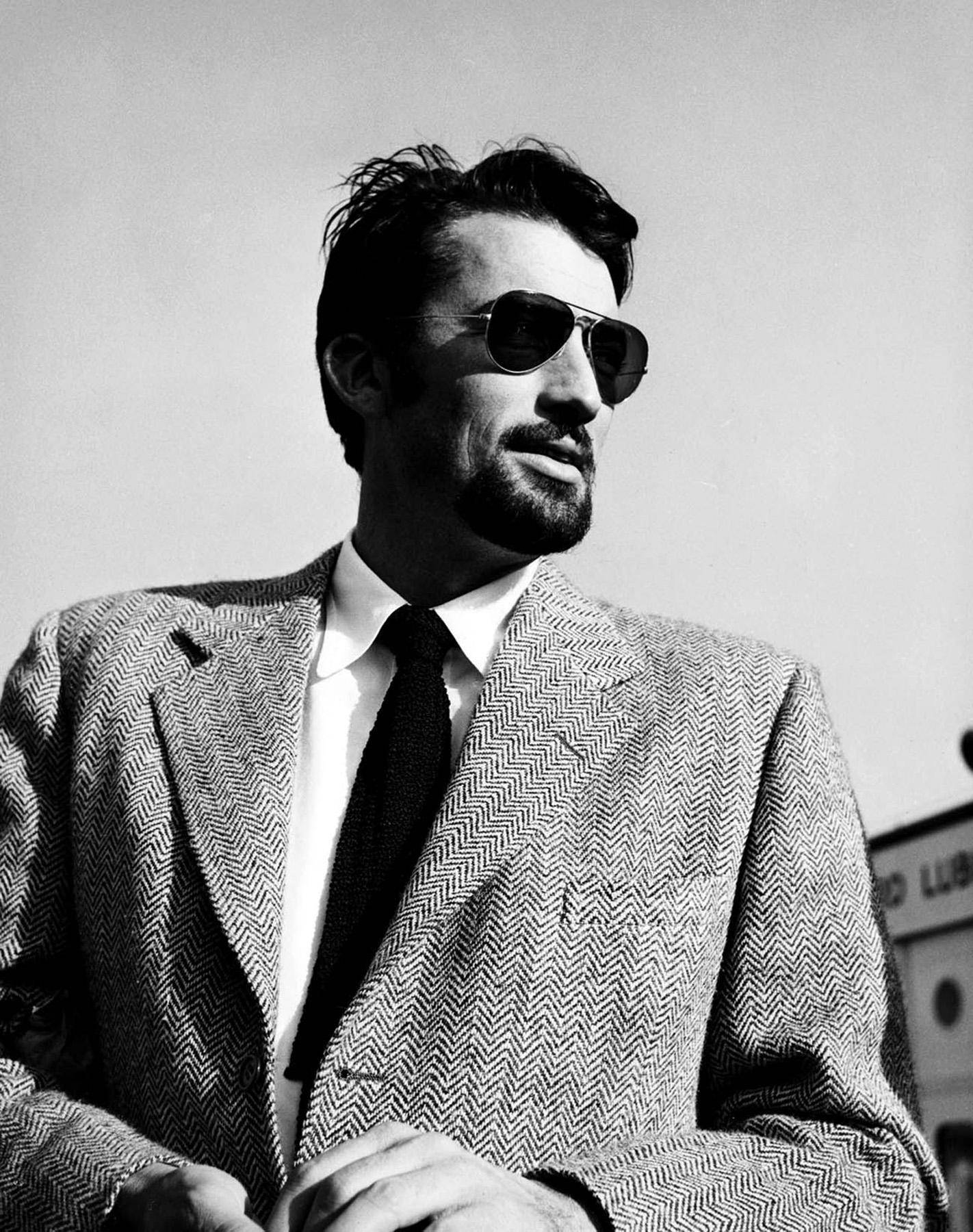 Timeless Elegance - Gregory Peck Wearing Sunglasses Background