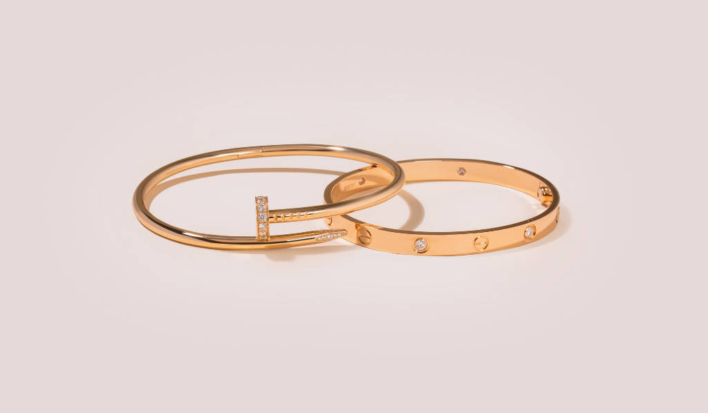 Timeless Luxury With Cartier Gold Nail Bracelet Background