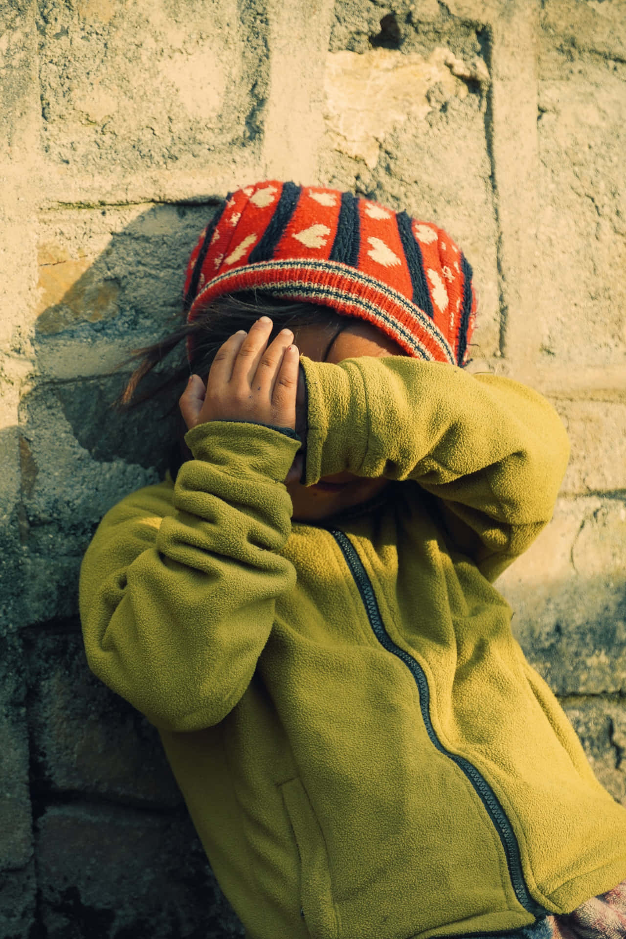Timid Child Hiding Face Background
