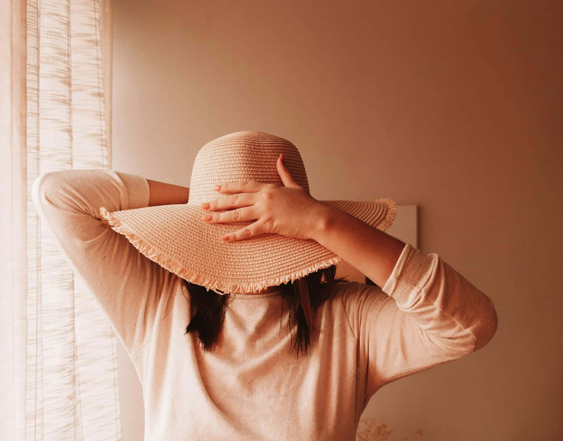 Timid Person Hiding Facewith Hat Background