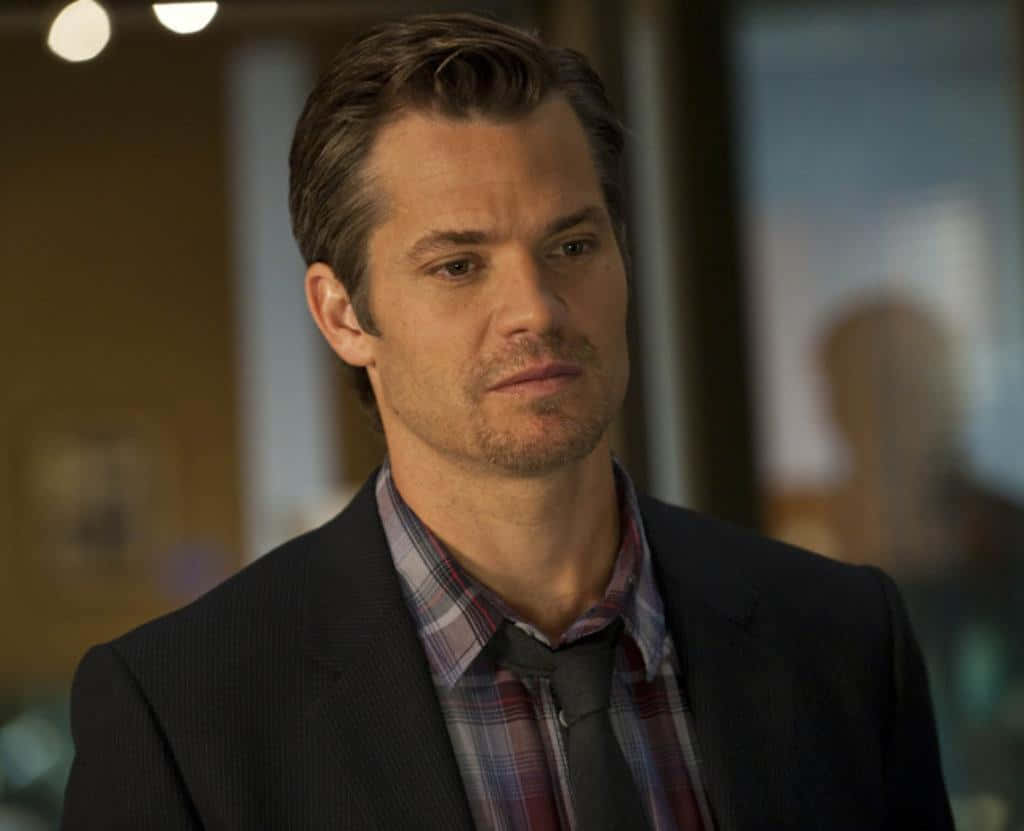 Timothy Olyphant Smirks In Close-up Background