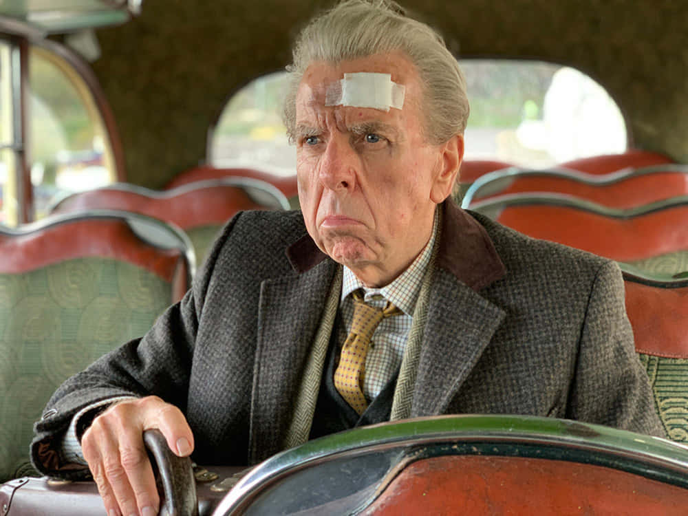Timothy Spall At A Press Event Background