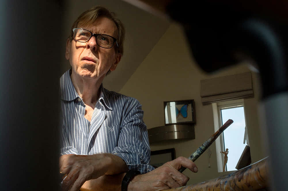 Timothy Spall Poses Elegantly In A Classic Suit And Tie Background