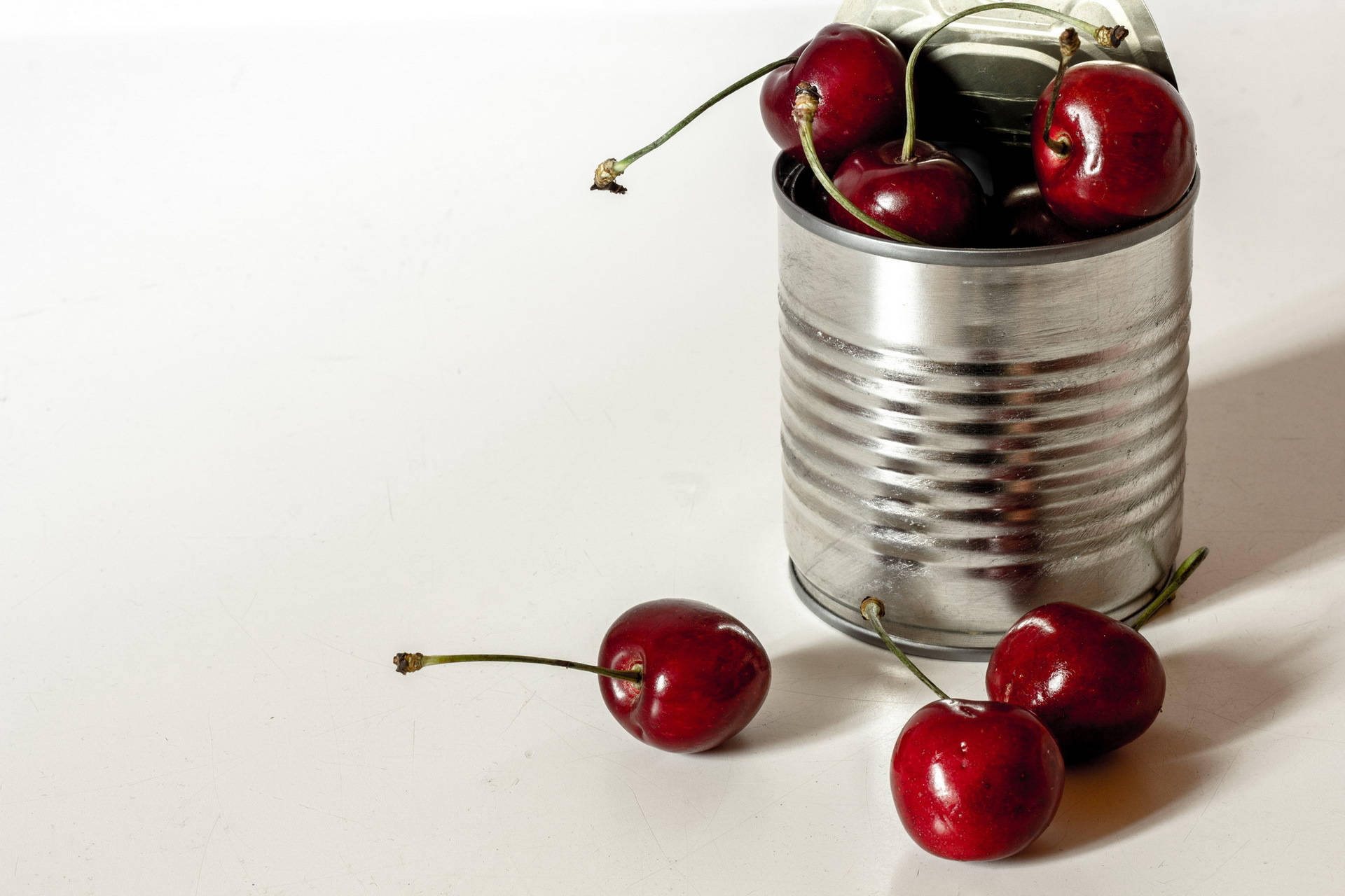 Tin Can Filled With Cherries Background