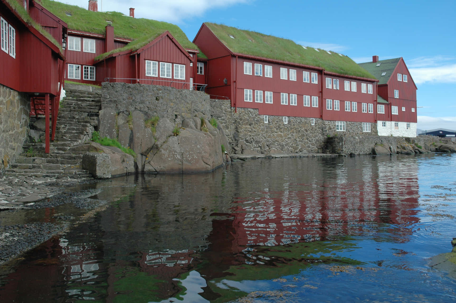 Tinganes Peninsula And Stone Wall In Thorshavn Background