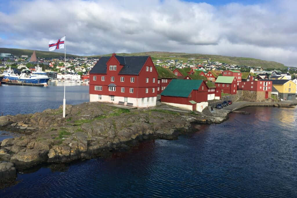 Tinganes With Faroe Island Flag At Thorshavn Background