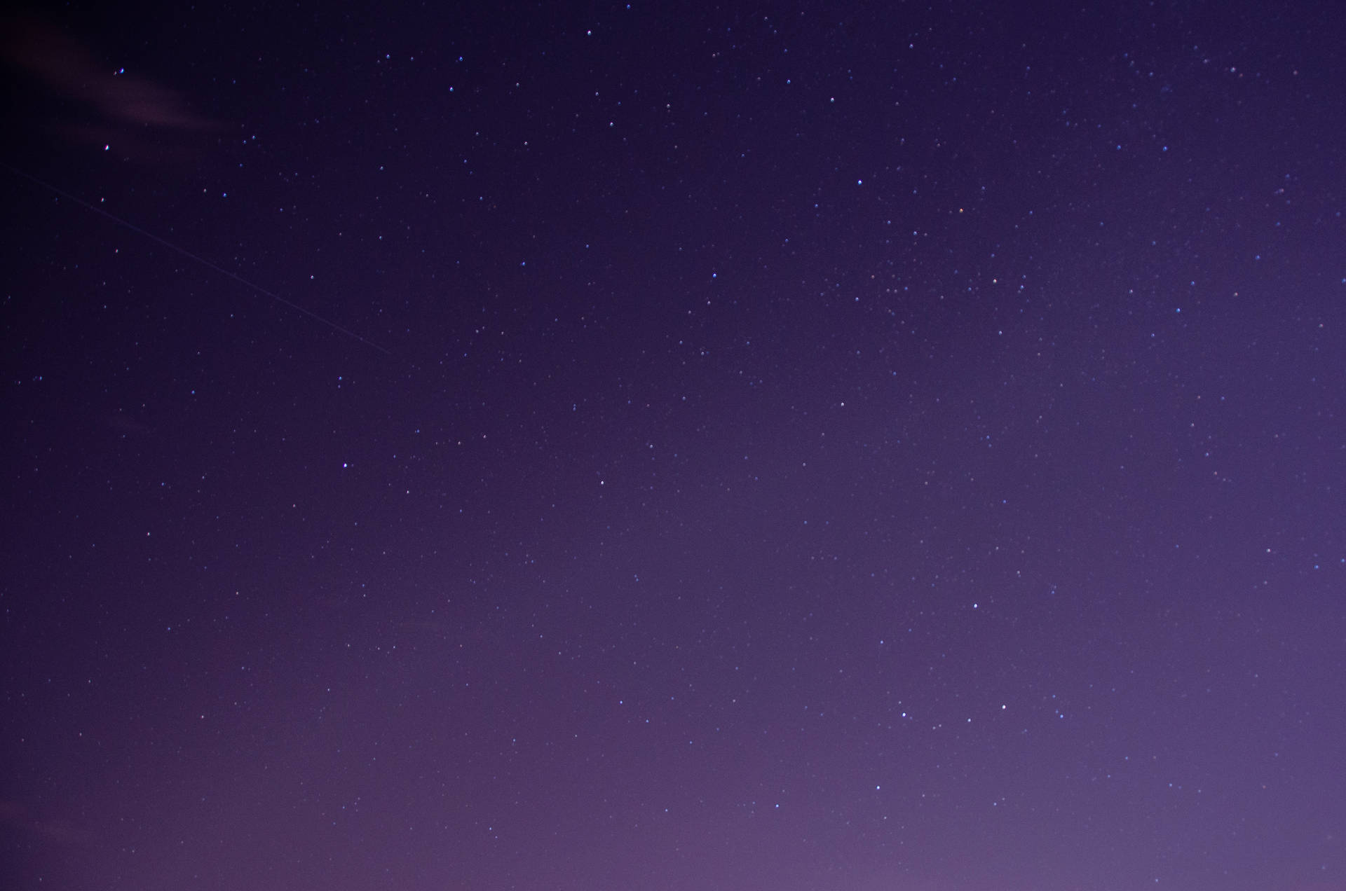 Tiny Stars In Purple Night Sky Background