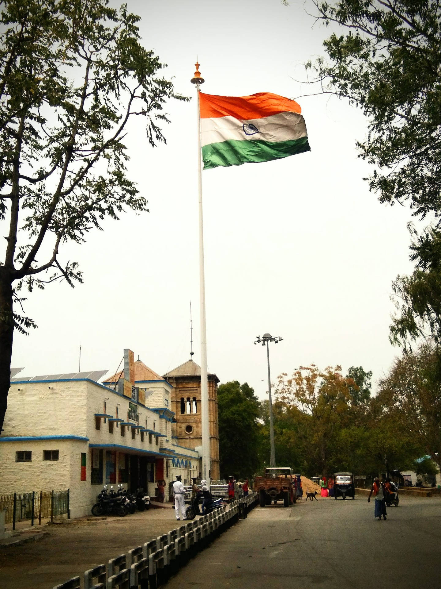 Tiranga Indian Flag Pole Beside Building Background