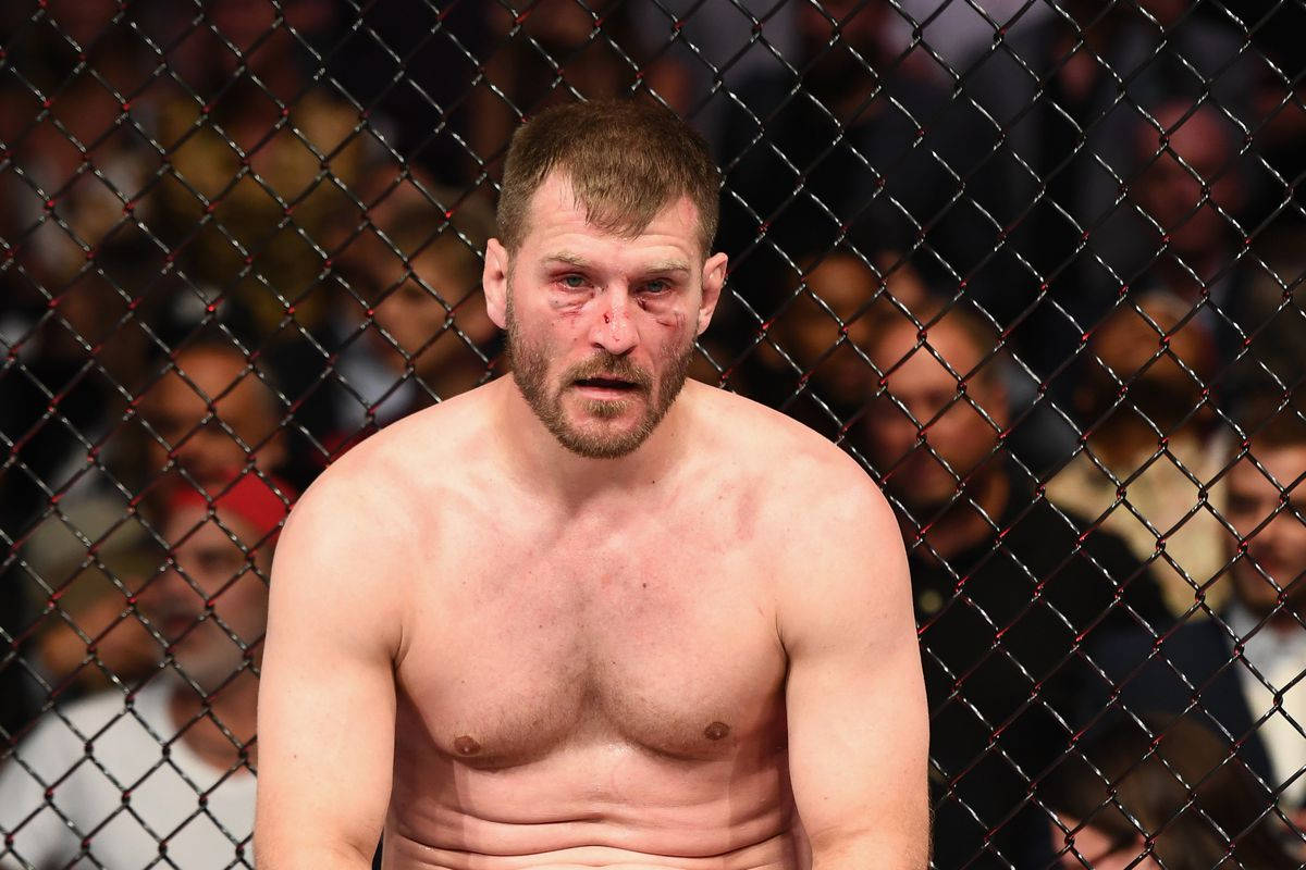 Tired Stipe Miocic Sitting Background