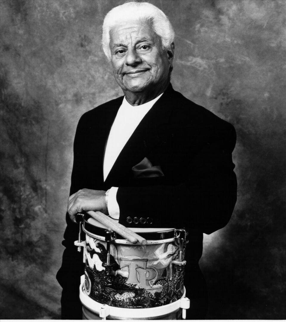 Tito Puente Sporting A Drum Background